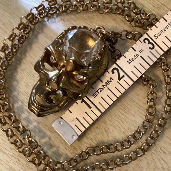 Somebody needs this gold color crystal brained scull necklace with sparkly eyes. - Picture 4 of 6